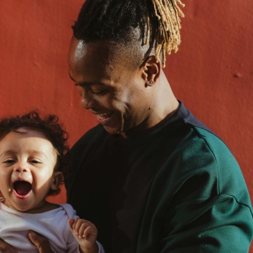a person holding a baby